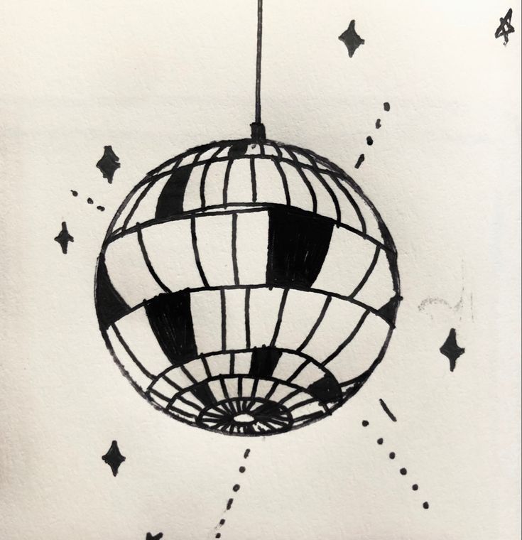 a black and white drawing of a ball hanging from a string with stars around it