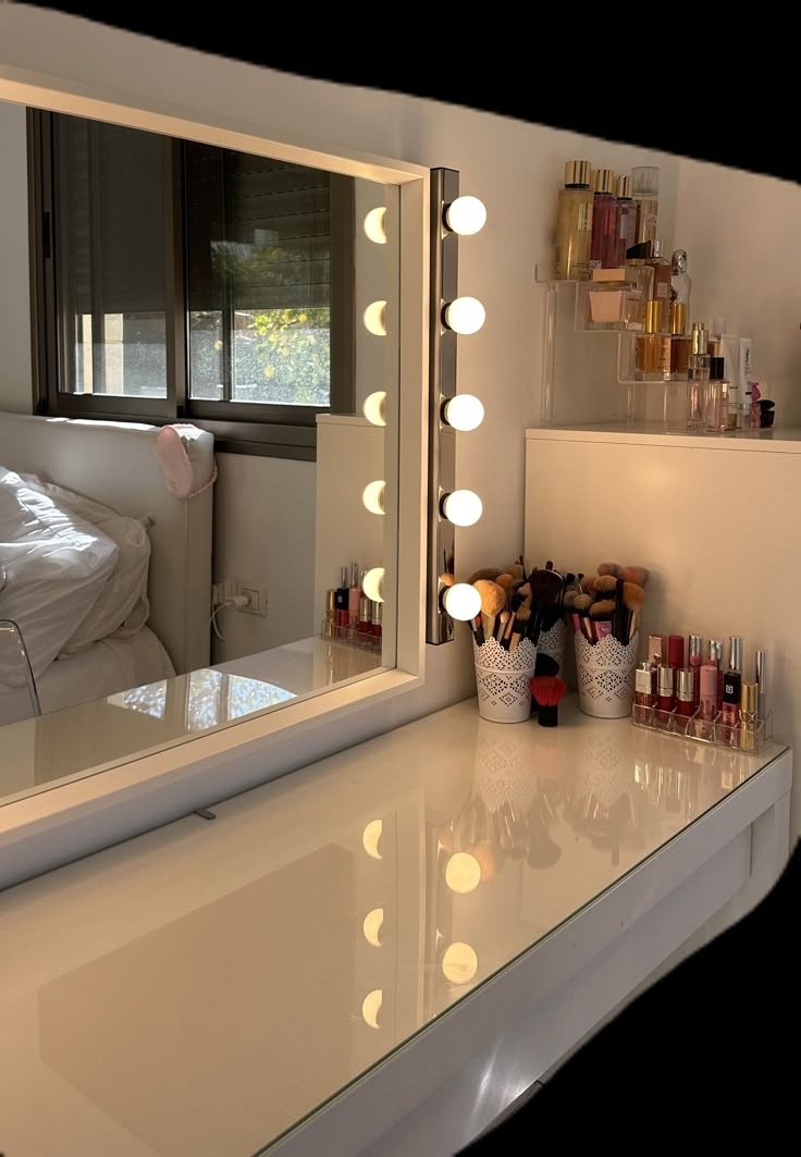 there is a vanity mirror with lights on it