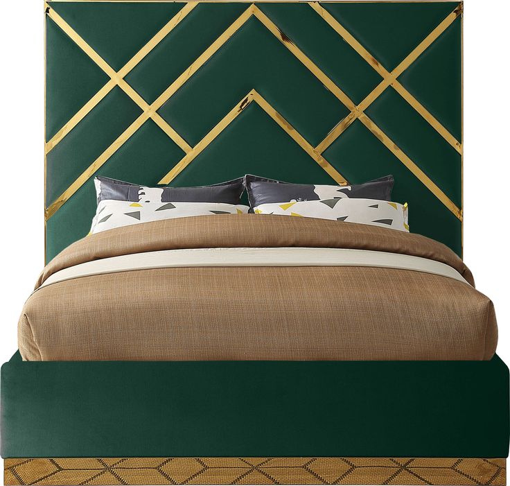 a bed with gold and black headboard, pillows and throw pillows on the bottom