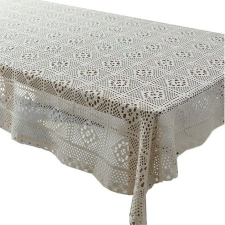 a white table cloth with an intricate design on the top and bottom, is shown in front of a white background