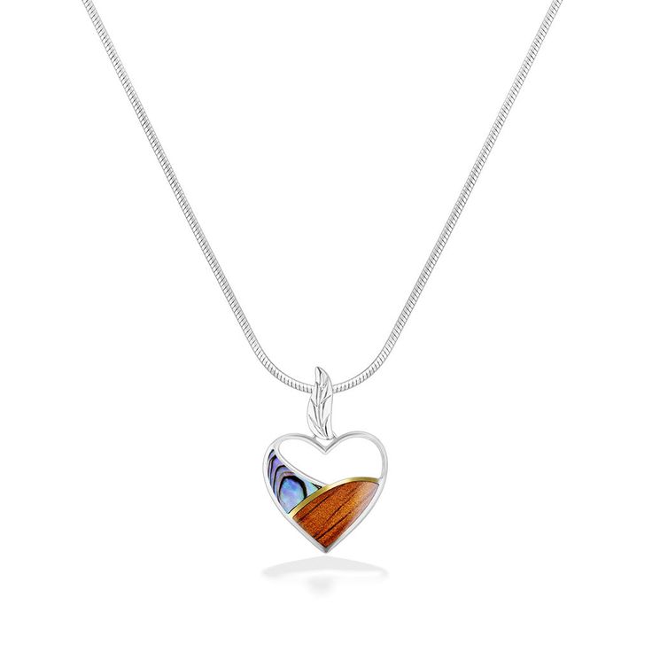 18K Yellow Gold and Sterling Silver Heart Pendant with Abalone Inlay and Hawaiian Koa Wood Inlay. 18" Sterling Silver Chain included. The pendant measures approximately 1" in length. Hallmarked Open Heart Necklace, White Pendant Necklace With Inlay, Elegant Necklace With Round Pendant Inlay, Elegant Round Pendant Necklace With Inlay, Double Heart Necklace, Sterling Silver Heart Pendant, Koa Wood, Silver Heart Pendant, Wood Inlay