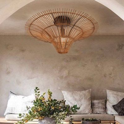 a living room filled with lots of furniture and decor on top of a wooden table