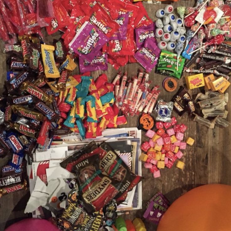 a pile of candy on top of a wooden table