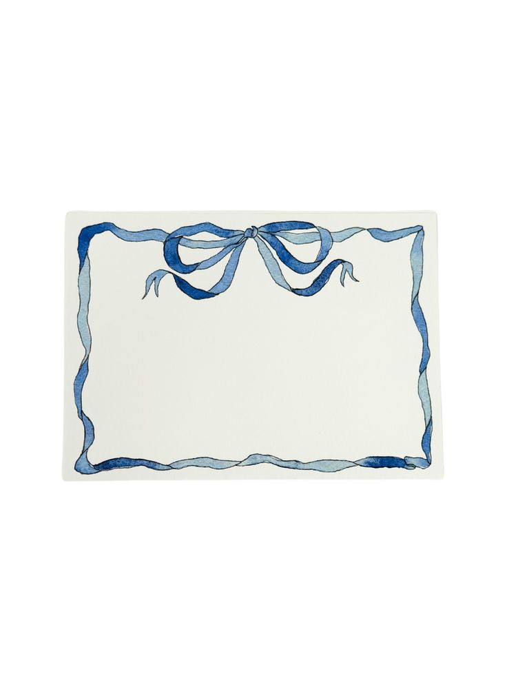 a blue and white place mat with a bow on it's edge, in the shape of a rectangle