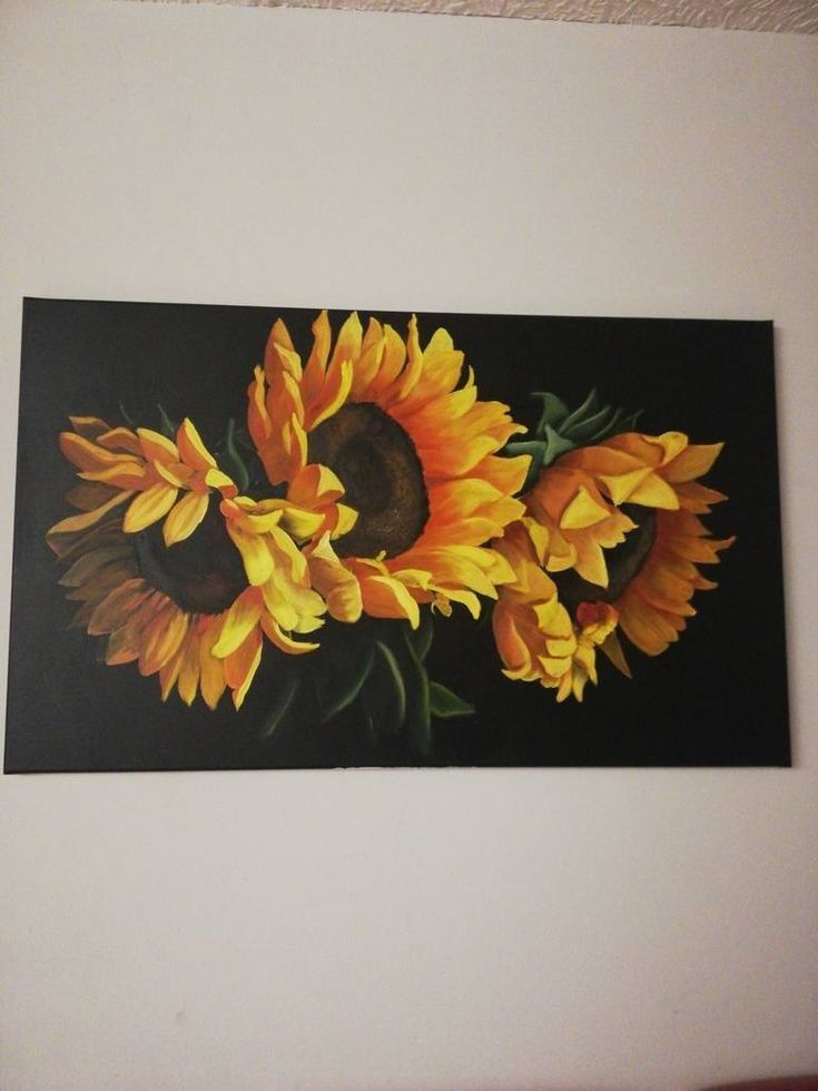 a painting of yellow sunflowers on a black background