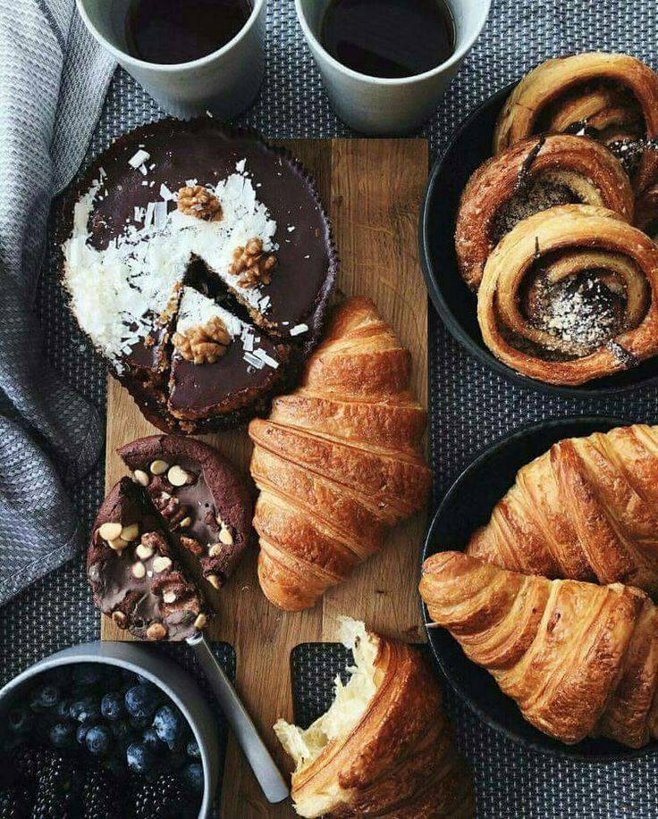 various pastries and desserts on a wooden board