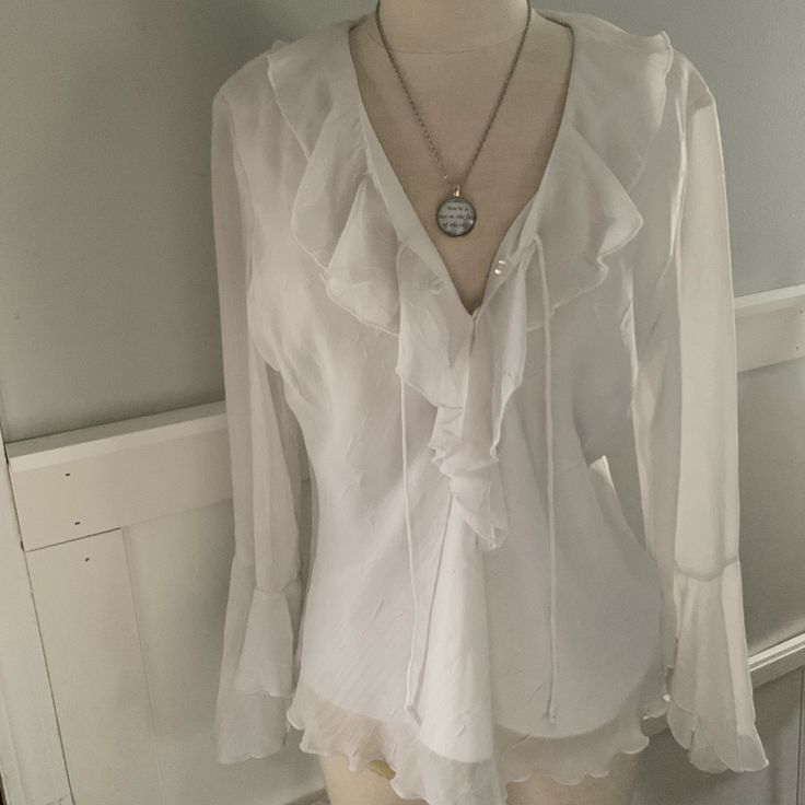 Vintage Y2k Silky White Fitted Blouse. Never Worn! (Measurements Included In Info) Delicately Patterned With A Subtle And Classy Design In White Complimenting The Bright White Layered Blouse With Flowing Bell Sleeves And Fitted At Waist. Gorgeous And Flowy Bell Style Sleeves. Very Silky Feel And So Airy And Comfortable While Keeping Everything Hidden Despite White Color. So Soft And Feminine. Very Current And Trendy. Size Medium But Can Fit Small As It’s Vintage. Perfect Day To Night Wear! Great Flowy Top Aesthetic, White Victorian Blouse, Flowy Sleeves Top, White Ruffled Blouse, White Vampire Outfit, White Pirate Outfit, White Blouse Aesthetic, Blouse Outfit Aesthetic, White Blouse Outfit Classy