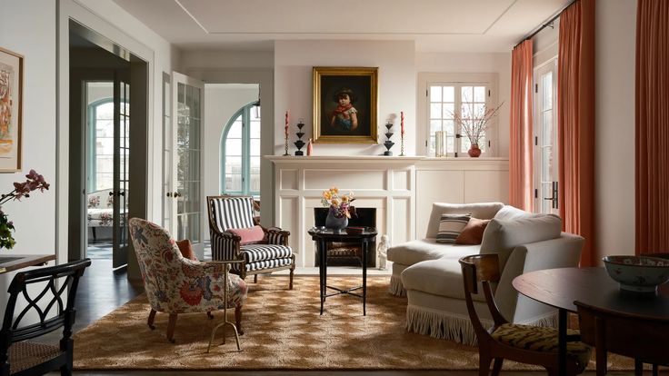 a living room filled with furniture and a fire place