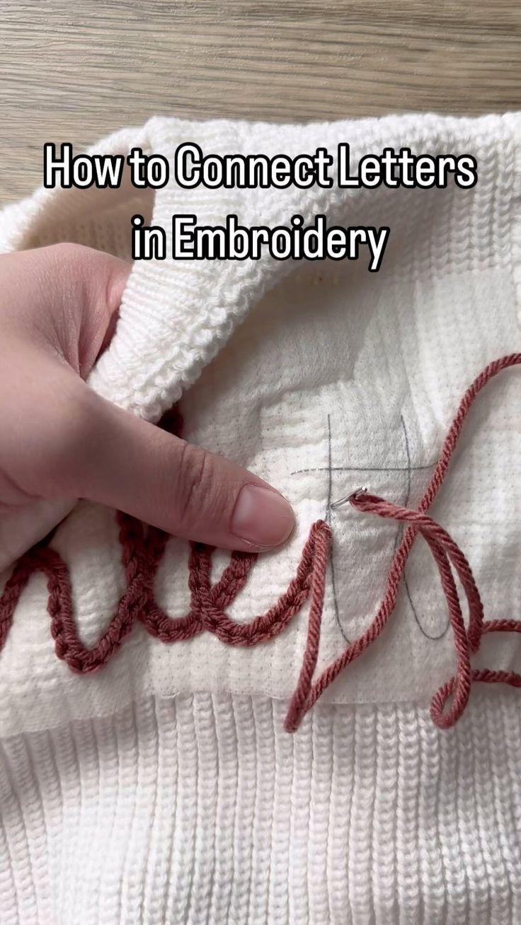 someone is stitching the letters in embroidery on a sweater that says, how to connect letters in embroidery