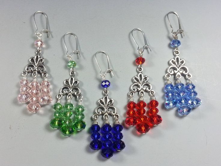 These Pretty Earrings have Triple Dangling 8mm and 6mm Rhondelle Shaped Crystal Beads with an Aurora Finish making them Extra Sparkly. They are firmly attached to Fleur-de-lie Style Tibetan Silver Centers. They are available in 5 colors : Pink, Green, Colbalt Blue, Red and Light Blue.  They are 2-1/8 inches long (not including the Silver Plated Kidney Style ear wires) and are relatively light weight considering their size. It's possible for me to make the same style of earrings in Other Colors o Cheap Crystal Earrings With Faceted Beads As Gift, Pumpkins Crafts, Diy Pumpkins Crafts, Diy Pumpkins, Red And Light Blue, Wire Jewelry Earrings, Diy Earrings Easy, Colbalt Blue, Silver Chandelier Earrings