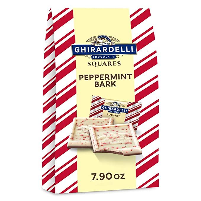 a box of peppermint bark candy on a white and red striped paper wrapper