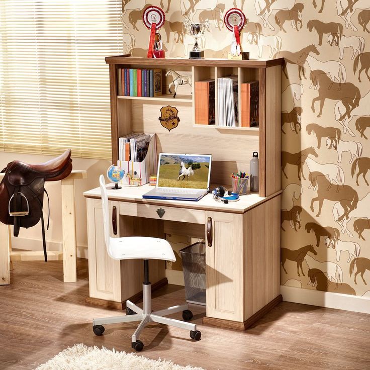 a wooden desk with a laptop on top of it next to a horse wallpaper