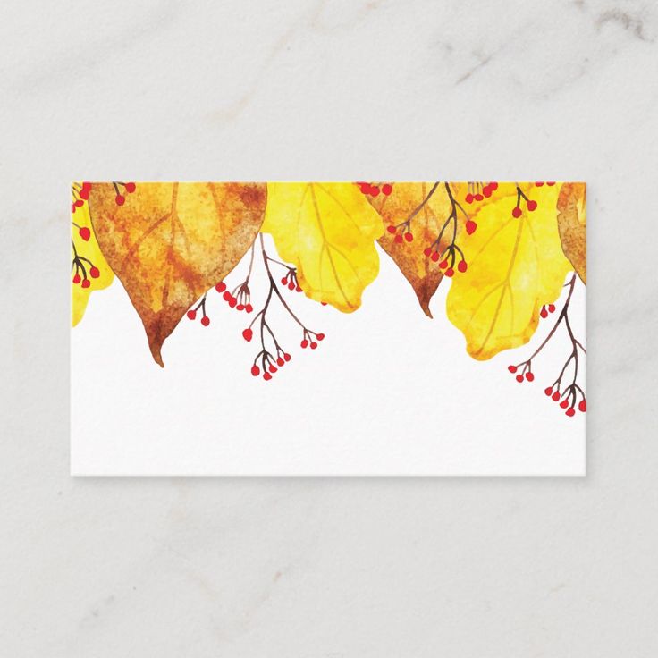 a business card with yellow leaves and berries