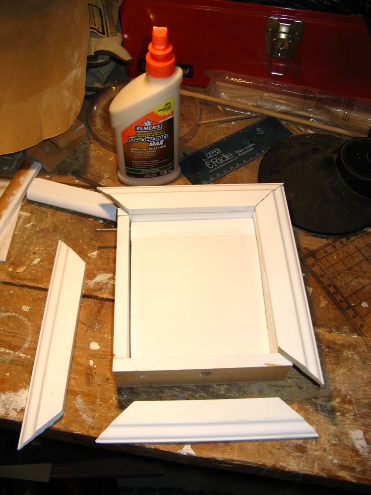 the paint is being applied on the white cabinet doors