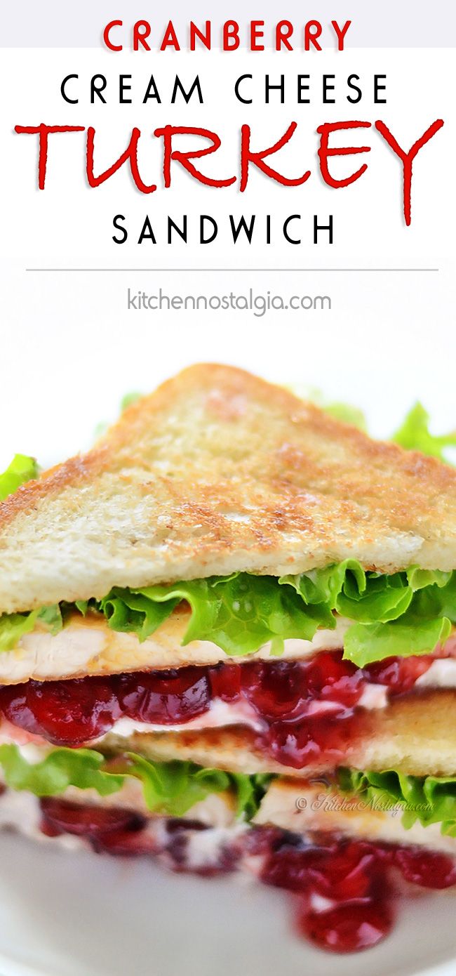 a sandwich with cranberry sauce and lettuce on toasted bread is sitting on a white plate