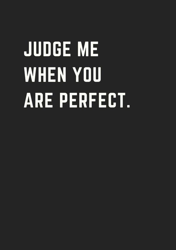 the words judge me when you are perfect on a black background