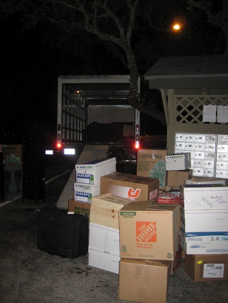 many boxes are stacked up outside at night