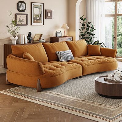 a living room filled with furniture and windows