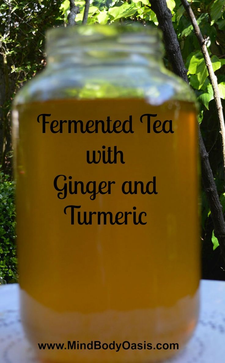 a jar filled with ginger and turment sitting on top of a white table