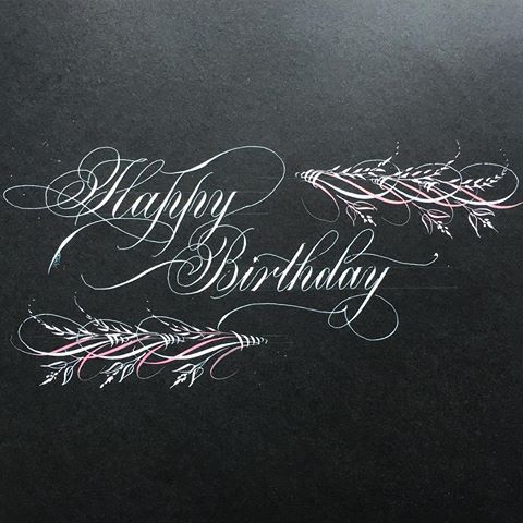 the words happy birthday written in chalk on a piece of black paper with white writing