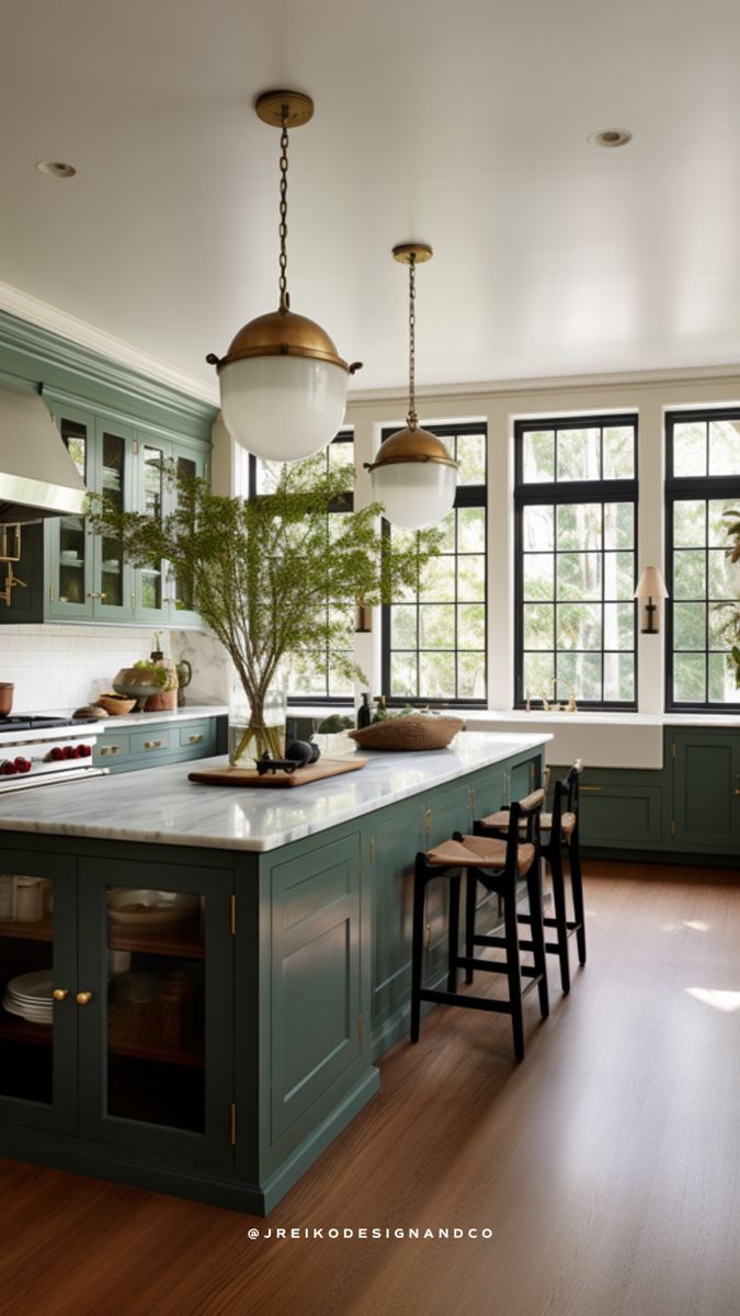 a large kitchen with green cabinets and wooden flooring, along with an island in the middle