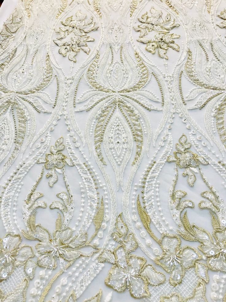 Ivory with gold highlights lace fabric. New! Collection 2019, lace fabric for bridaldress or evevning gown. Create a gorgeous beaded fabric wedding dress, just beautiful quality Sold by the yard Gold Embroidered Wedding Dress For Reception, Elegant White Mother Of The Bride Dress For Ceremony, Elegant White Lace With Intricate Embroidery, Gold Wedding Dress With Intricate Embroidery For Reception, Elegant Off White Gown With Intricate Embroidery, Elegant Embroidered Wedding Dress For Reception, Elegant Off White Gown For Reception, Gold Lace Wedding Gown, Elegant Cream Wedding Dress For Ceremony