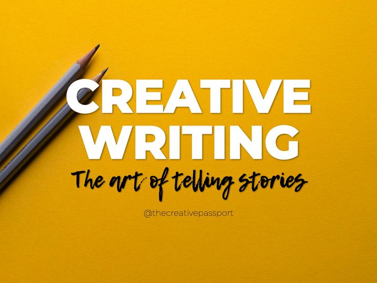 two pencils sitting on top of a yellow table next to the words creative writing