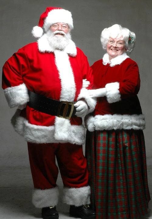 two people dressed as santa claus and mrs claus