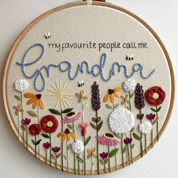 a hand embroidered wall hanging with flowers and the words, my favorite people call me grandma