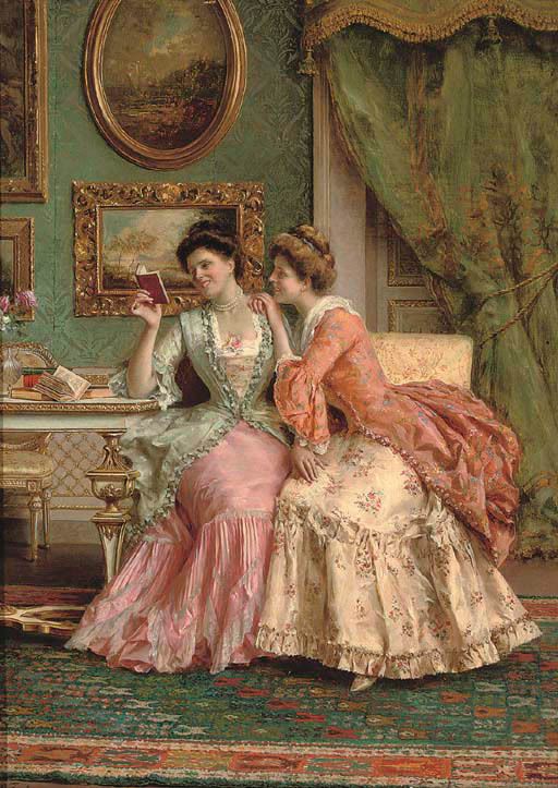 two women in dresses sitting on a couch