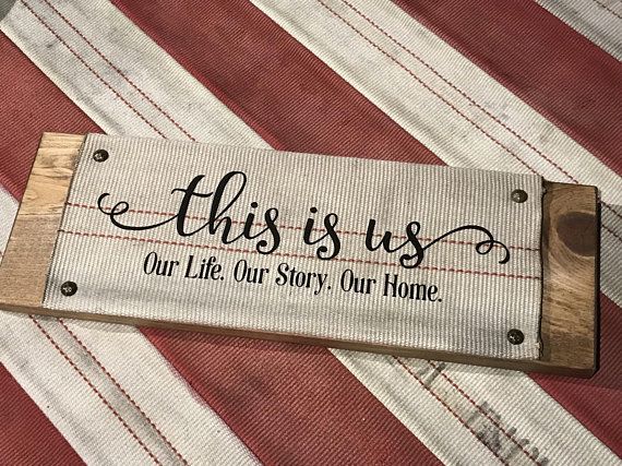 a wooden sign that says, this is us our life, our story, our home