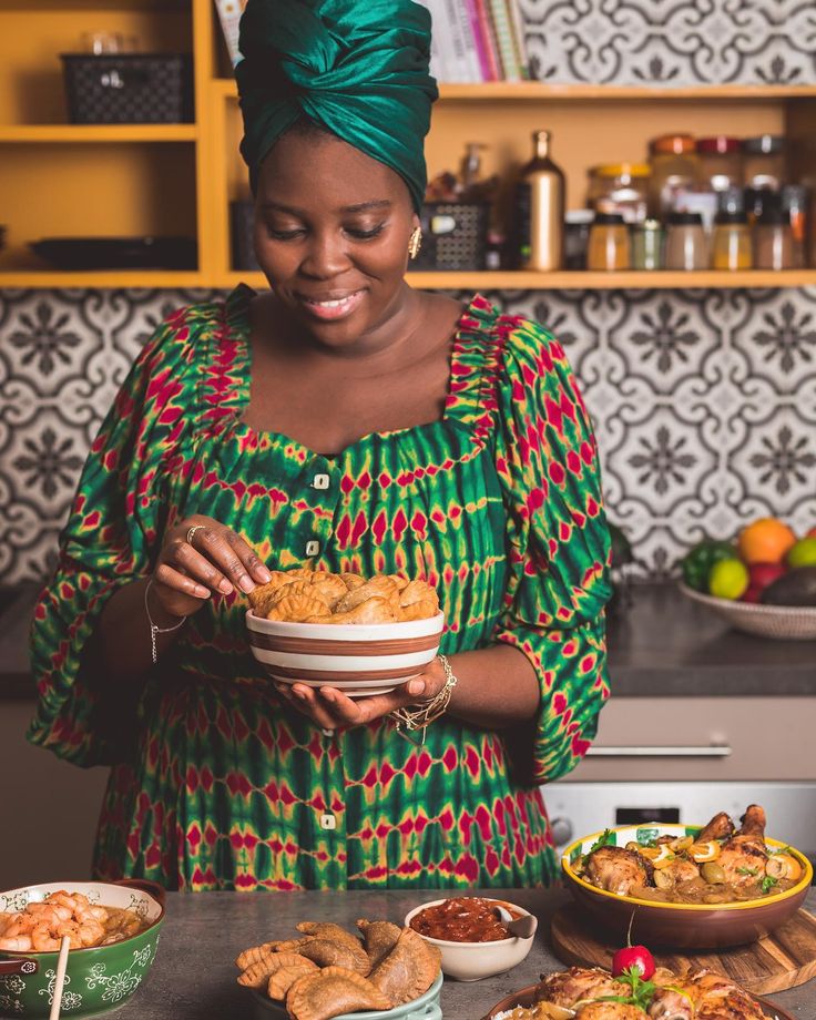 a woman holding a bowl of food in her hands