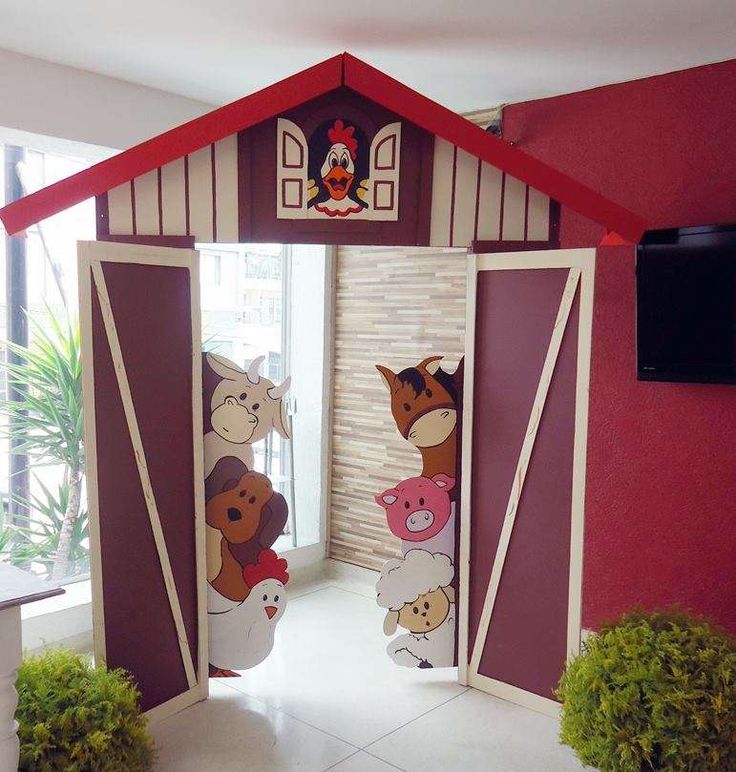 an open door to a small house with animals painted on the doors and windows in it