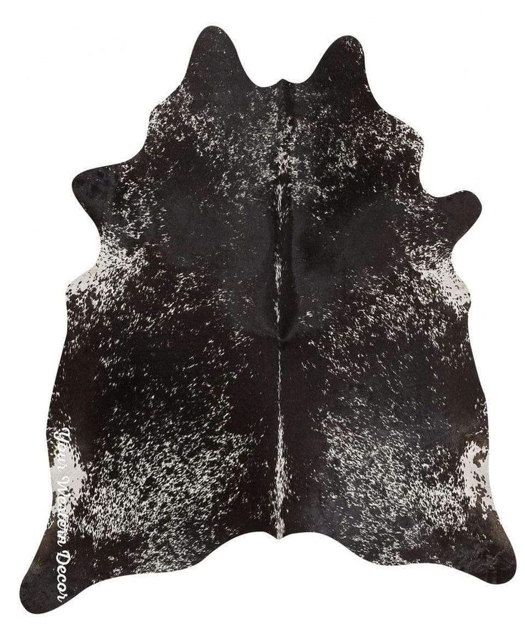 a black and white cowhide rug on a white background