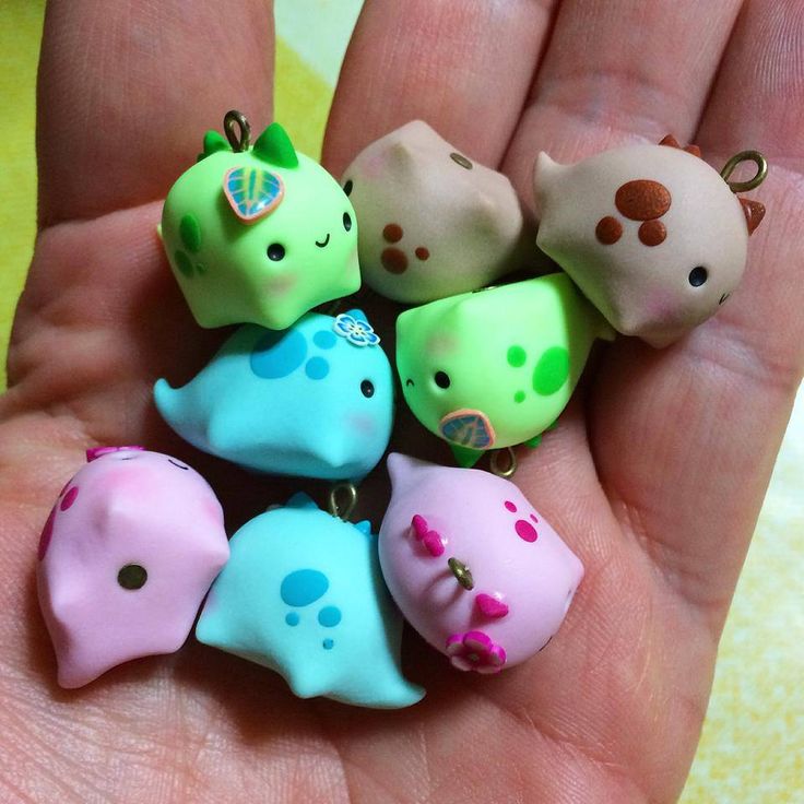 there are many small toy animals in the hand