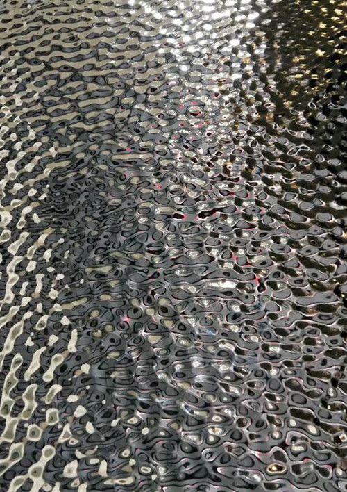 the surface of water that has been made with circles and dots on it, as well as