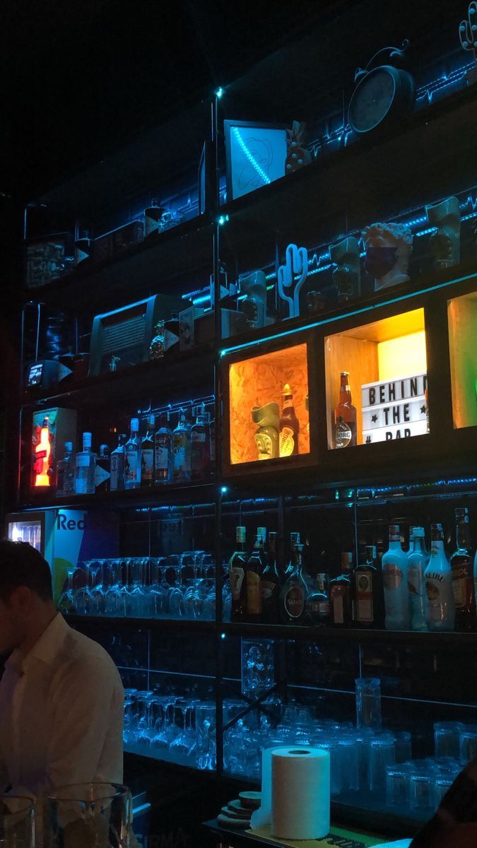 the bar is filled with liquor bottles and glasses