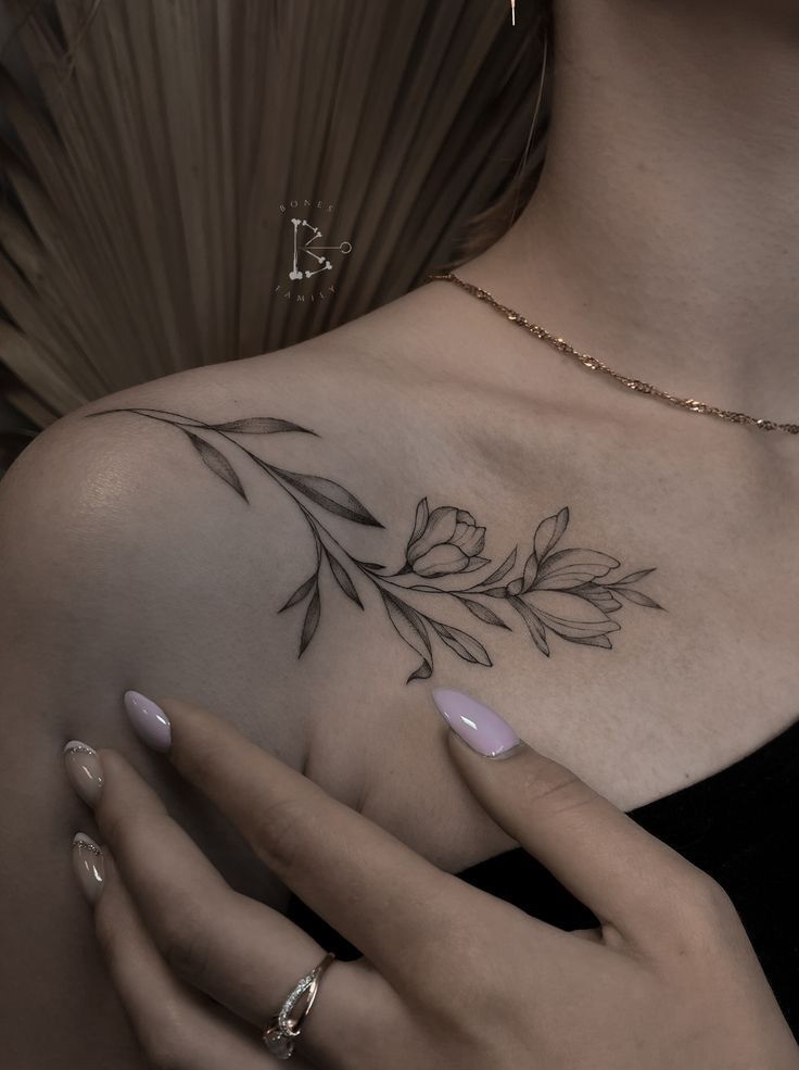 a woman's chest with leaves on it