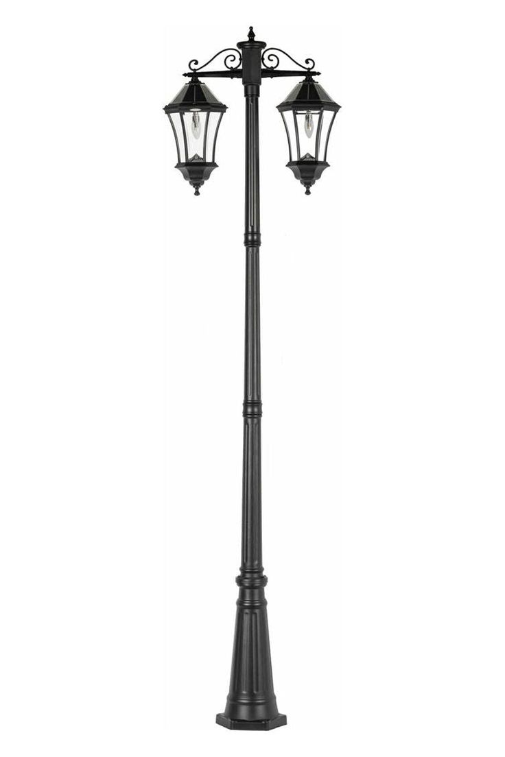 a black lamp post with two lights on top and one light attached to it's side