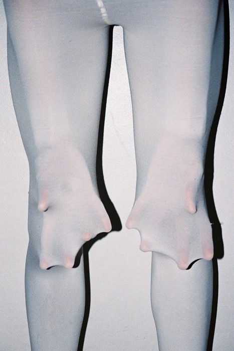 the legs and ankles of a woman in white stockings