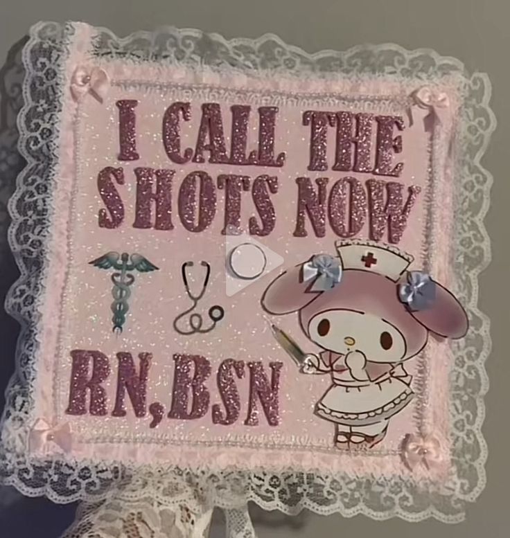 a pink sign that says i call the shots now rnbsn with an image of a nurse holding a stethoscope