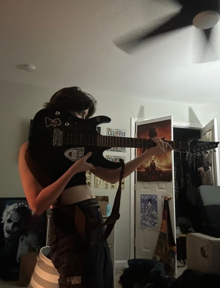 a person with a guitar strapped to their back