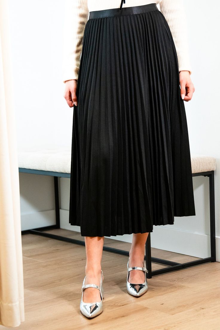 Get ready for an evening out with our Victoria skirt. Featuring a luxurious black accordion pleated design, this midi length skirt exudes elegance and refinement. Elevate any outfit with this chic and sophisticated piece. Elastic satin waistband Mary Grace is wearing XS/S with a 32B bust, 25” waist and 36” hip. 95% Polyester, 5% Spandex Hand wash cold and line dry Midi Skirt With Folds For Party, Party Midi Skirt With Folds, Evening Relaxed Fit Midi Skirt, Flared Accordion Pleated Skirt For Party, Flared Pleated Skirt With Accordion Pleats For Party, Sleek Party Midi Skirt, Elegant Folded Maxi Skirt For Evening, Elegant Evening Maxi Skirt With Folds, Elegant Evening Skirt For Fall