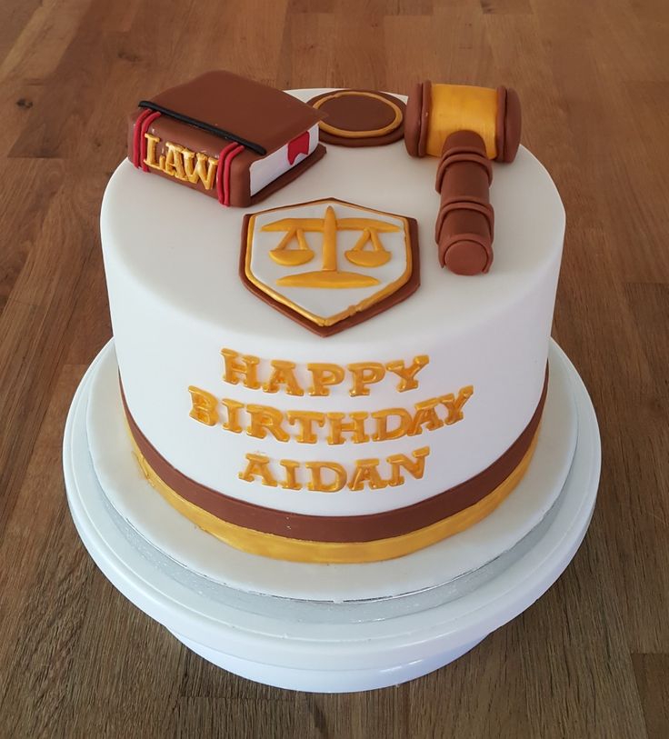 a birthday cake with law books and gavel on top