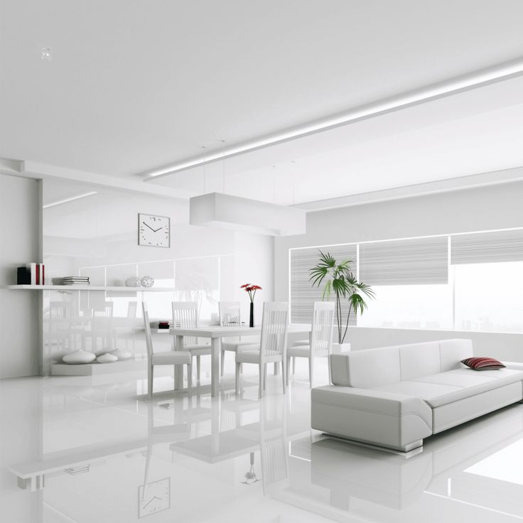 a white living room filled with furniture and a large window