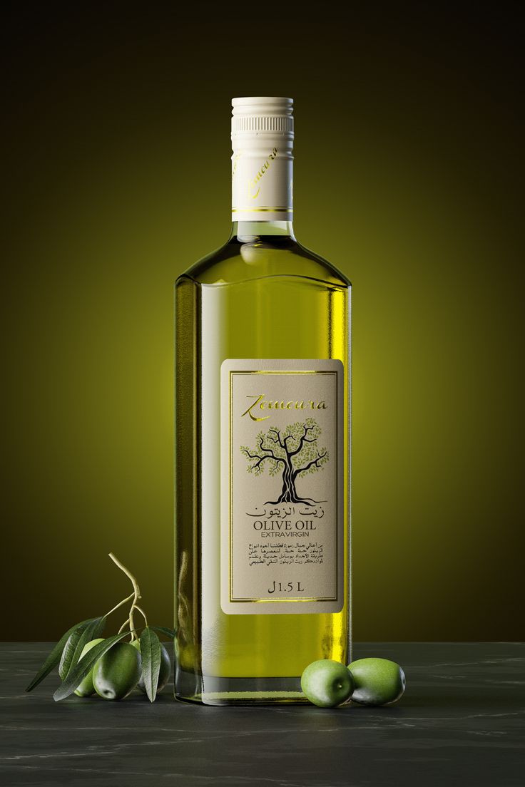 a bottle of olive oil next to an olive branch on a wooden table with green background