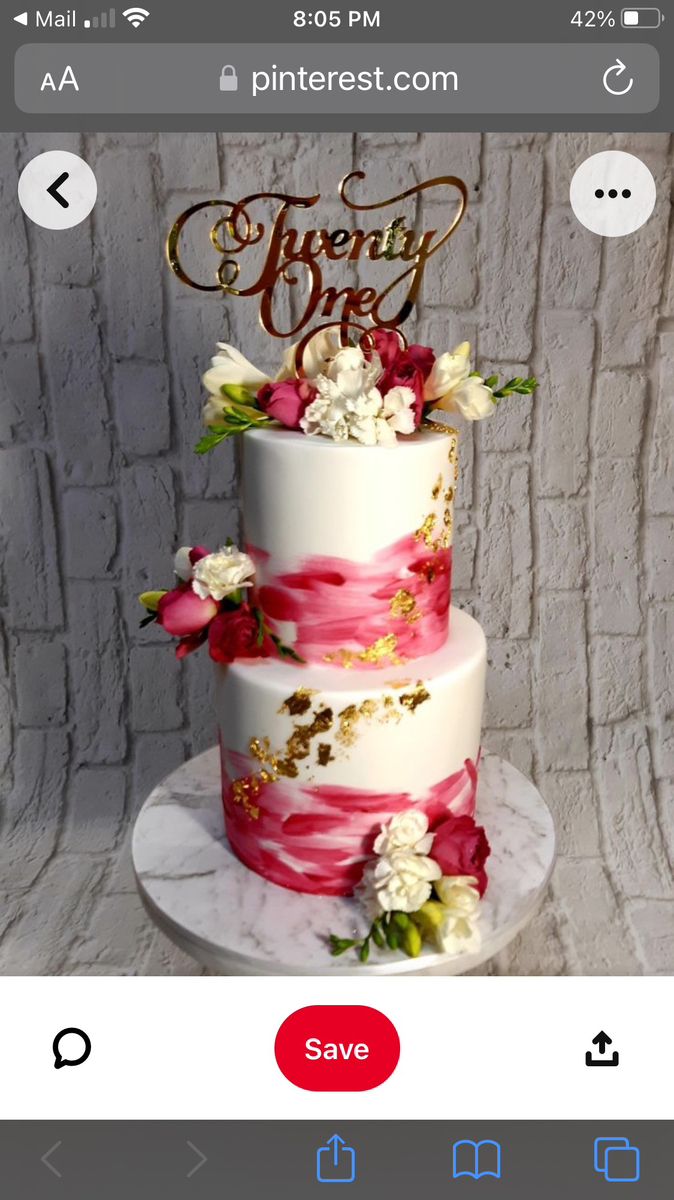 a white and pink wedding cake with flowers on the top is being viewed on an iphone