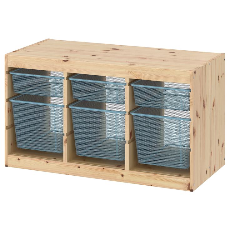 a wooden shelf with four bins on it