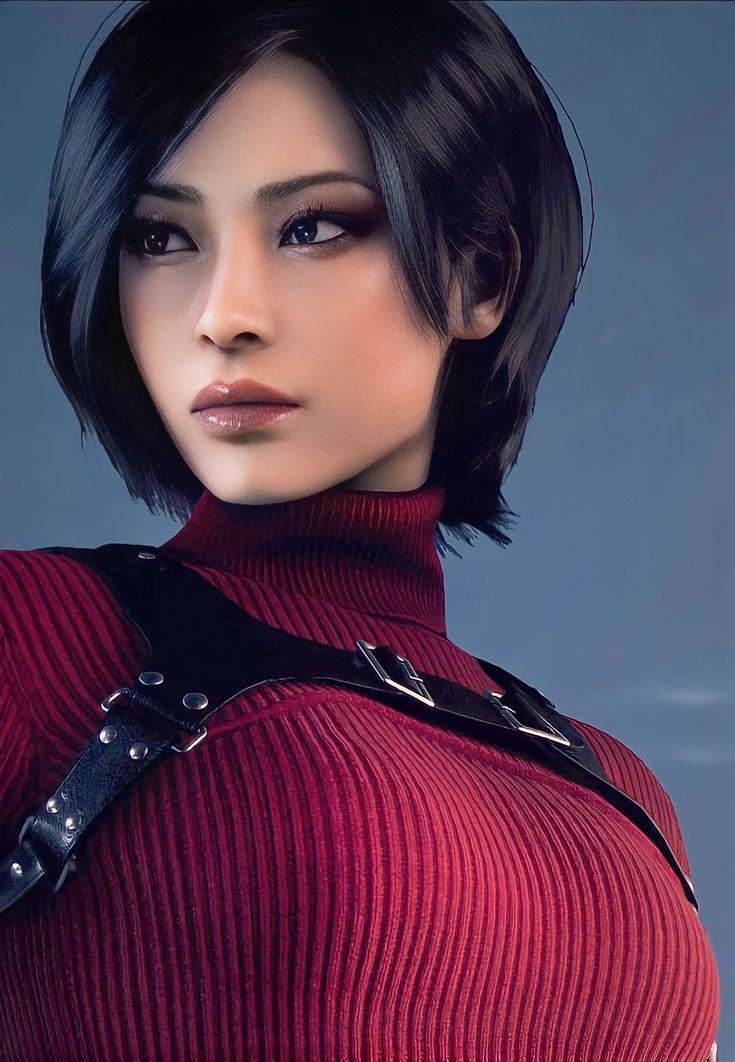 a woman with short black hair wearing a red sweater and leather suspenders is looking at the camera