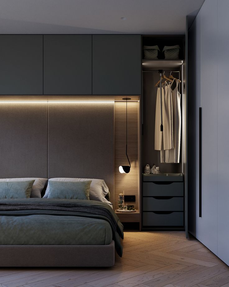 a bedroom with a bed and closets in it